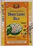 DHUM LAXMI (and logo) trademark logo