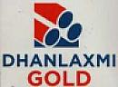 DHANLAXMI GOLD (and logo) trademark logo