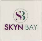SKYN BAY (and logo) trademark logo