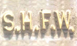 S.H.F.W. (and logo) trademark logo